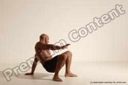 Underwear Gymnastic poses Man Black Muscular Bald Dancing Dynamic poses Academic